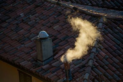 Smoke stack on roof of building