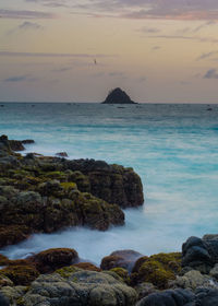 Scenic view of sea against sky at sunset