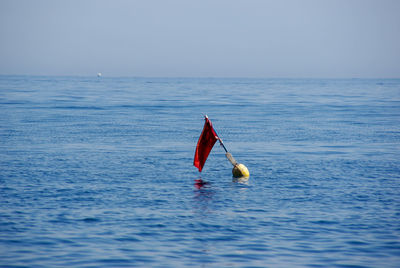 View of ball in sea against sky