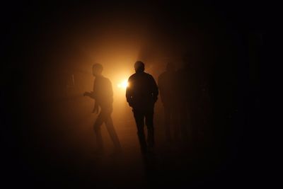 Woman in dark room