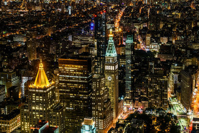 Aerial view of city lit up at night