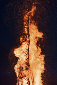 Panoramic shot of fire against black background