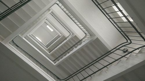 Directly below shot of spiral staircase of building