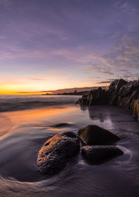 Scenic view of sea against sky during sunset