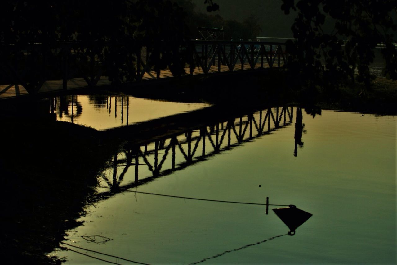 water, reflection, silhouette, river, outdoors, waterfront, sunset, nature, tree, no people, day, architecture, beauty in nature, sky