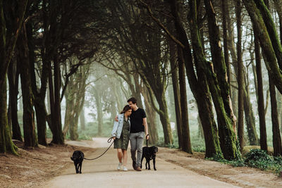 Woman with dog in forest