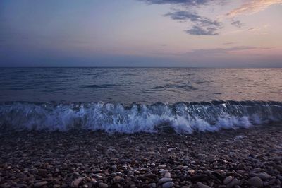 Scenic view of sea against cloudy sky