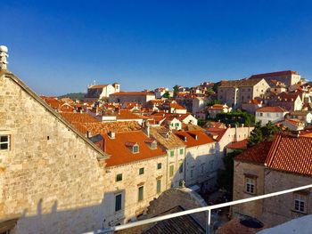 Houses against clear blue sky