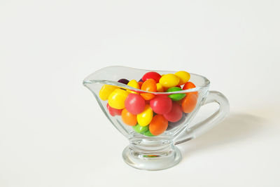 Close-up of multi colored candies in container