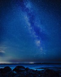 Scenic view of sea against sky at night