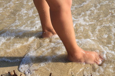 Low section of child on beach