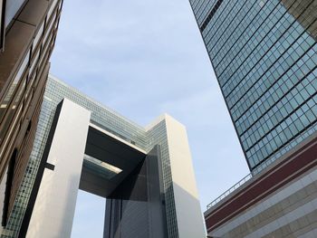 Low angle view of modern buildings against sky