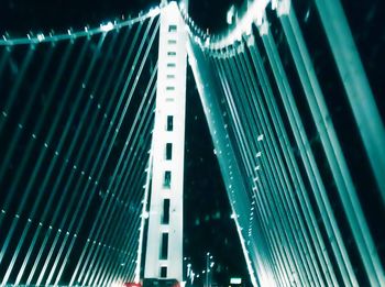 Low angle view of illuminated buildings in city at night