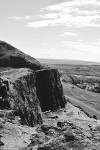 Scenic view of cliff against sky