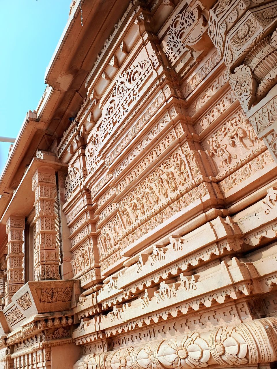architecture, built structure, building exterior, low angle view, building, history, the past, no people, travel destinations, craft, facade, religion, wood, day, temple - building, temple, pattern, ancient, travel, tourism, wall, ornate, belief, outdoors, sky, brick, tradition, nature, place of worship, architectural feature, mansion, roof, spirituality