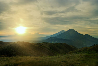 Scenic view of mountains against sky during sunset