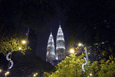 Low angle view of illuminated buildings at night