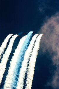 Low angle view of airplane flying against sky