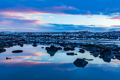 Scenic view of sea against sky during winter