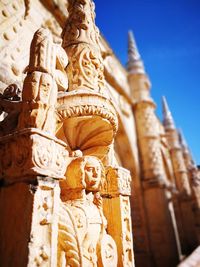 Low angle view of statue against temple