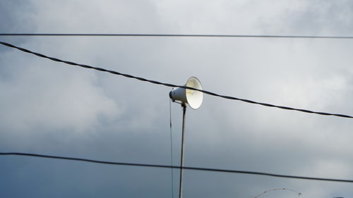 Low angle view of street light against sky