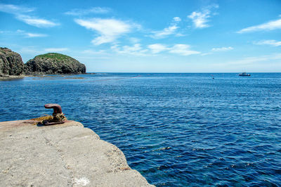 Scenic view of dock and sea against sky