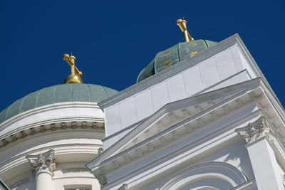 Low angle view of statue of building against sky