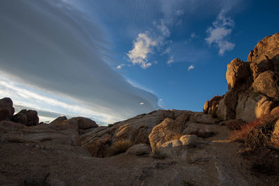 Low angle view of rocks against sky