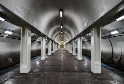 Empty underground urban subway station platform