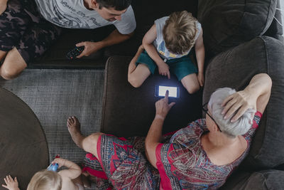 Grandmother with grandson using cell phone