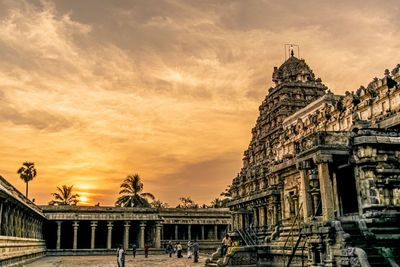 Low angle view of temple building against sky during sunset