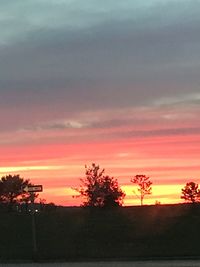 Silhouette trees against sky during sunset