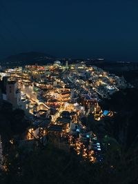 High angle shot of illuminated townscape against sky at night