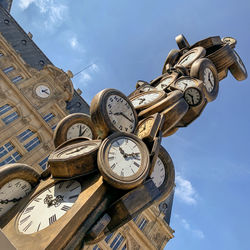 Low angle view of clock tower against sky