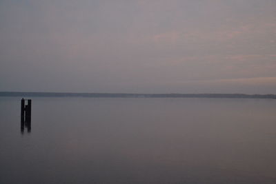 Scenic view of sea against sky at sunset