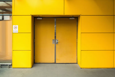 Yellow closed door of building