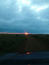 Scenic view of landscape against cloudy sky