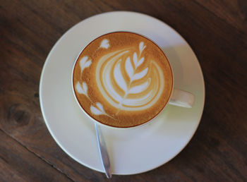 High angle view of cappuccino on table