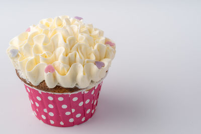 Close-up of cupcakes against white background