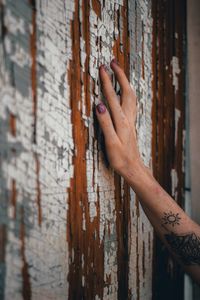 Close-up of human hand on wall