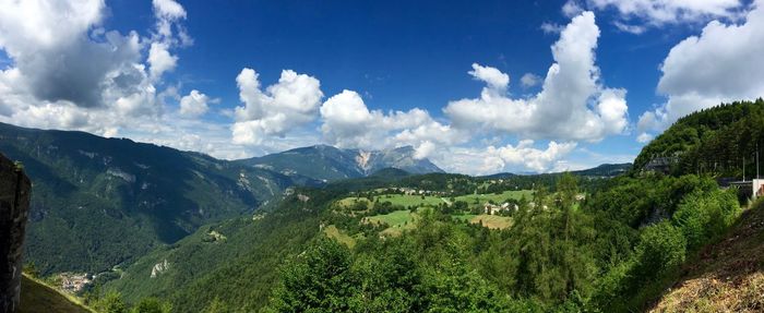 Scenic view of mountains against cloudy sky