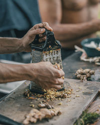 Midsection of man preparing food