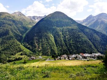 Scenic view of landscape and mountains against sky