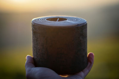 Close-up of hand holding drink
