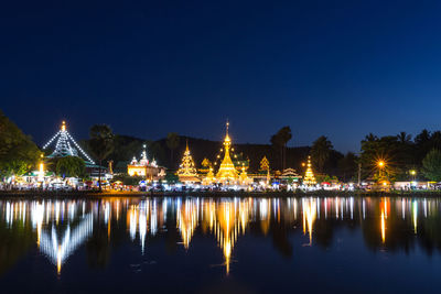 Reflection of illuminated buildings in water at night