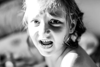 Close-up portrait of girl screaming