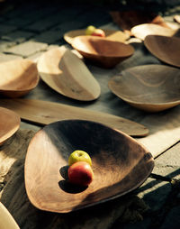 High angle view of apples on wooden plate