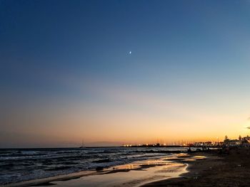 Scenic view of sea against clear sky during sunset