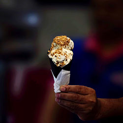 Close-up of person holding ice cream cone