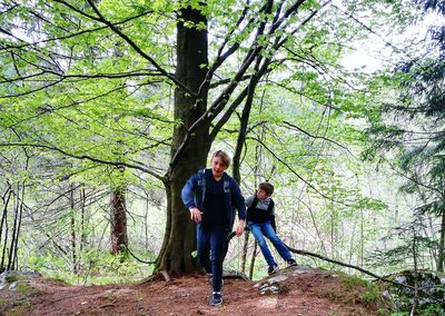 Full length portrait of friends in forest